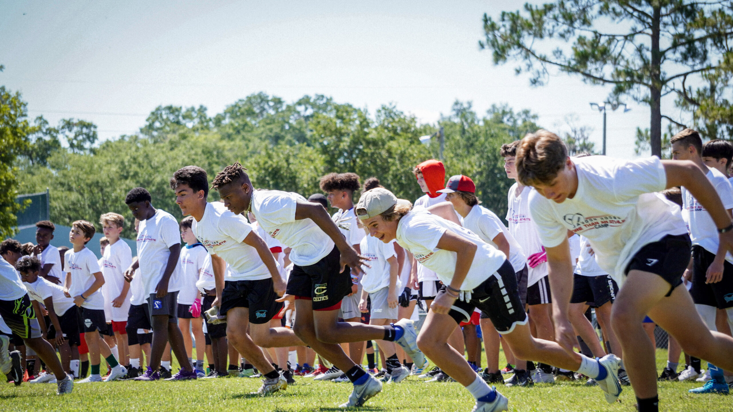 Young athletes sprinting through drills at the Jaydon Hodge More Than an Athlete Camp
