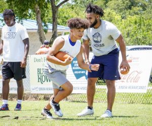 Future athlete running through a running back drill at the Jaydon Hodge More Than An Athlete Camp.