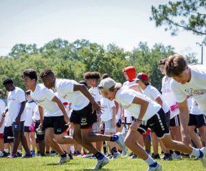 Young athletes sprinting through drills at the Jaydon Hodge More Than an Athlete Camp
